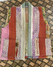 Handcrafted kantha quilt showcasing vibrant patterns as a perfect addition to sustainable fashion home décor.