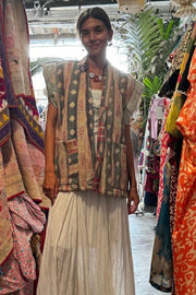 Handcrafted kantha quilt showcasing vibrant patterns as a perfect addition to sustainable fashion home décor.